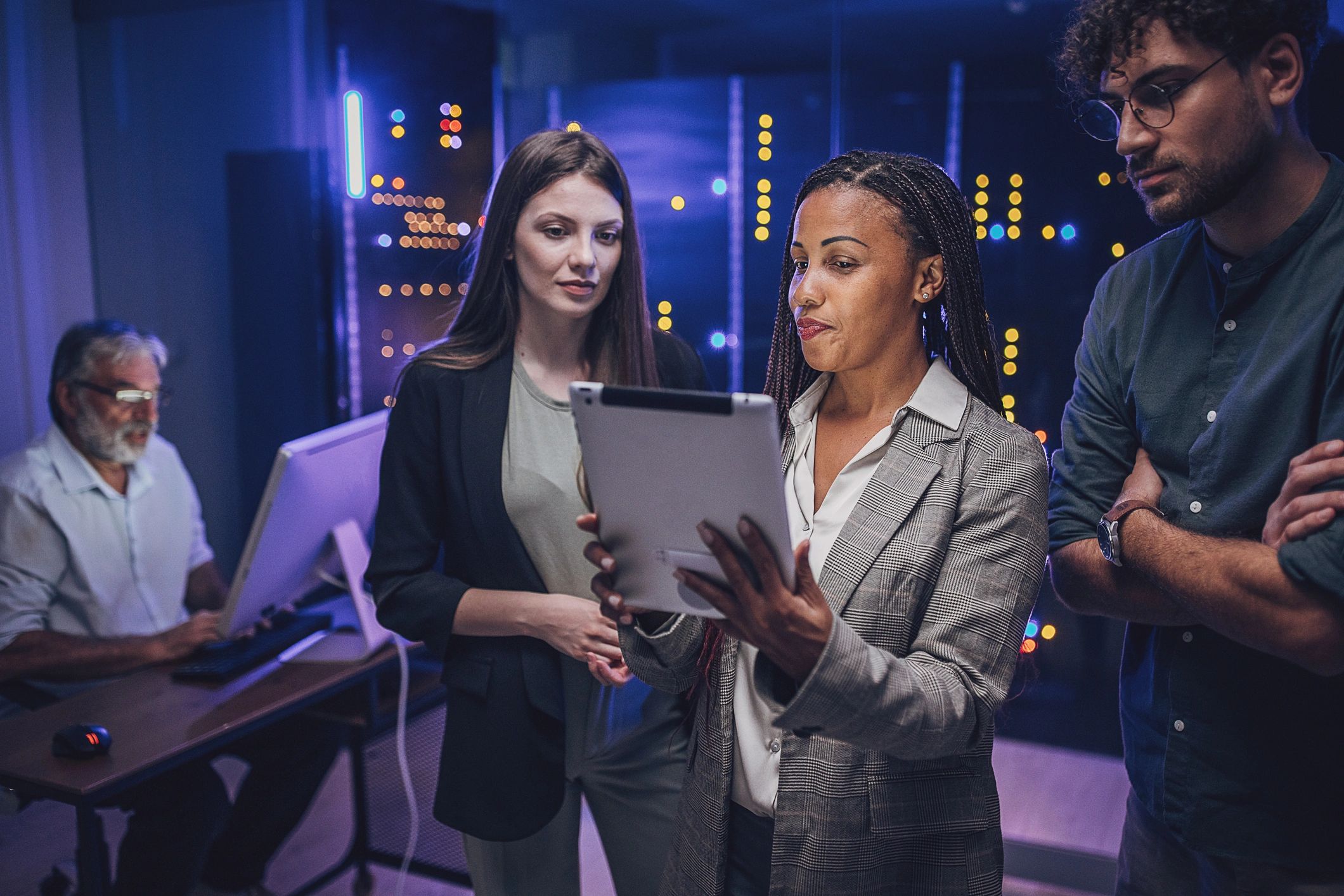 diverse IT professionals working in secure operations center